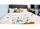 Adorable bedroom featuring a themed bedspread with pillows and stuffed animals at 2568 Morning Glory Pl, Lawrenceville, GA 30044