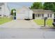 Charming single-Gathering home with a well-maintained front yard and a long driveway at 2568 Morning Glory Pl, Lawrenceville, GA 30044