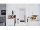 Stylish kitchen showcasing white cabinets, granite countertops, and stainless steel appliances at 2568 Morning Glory Pl, Lawrenceville, GA 30044
