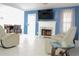 Inviting living room with fireplace, a mounted TV, tile flooring, and comfortable recliner seating at 2568 Morning Glory Pl, Lawrenceville, GA 30044