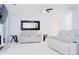 Bright living room with vaulted ceiling, modern furniture, and tile floors at 2568 Morning Glory Pl, Lawrenceville, GA 30044