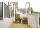 Enjoy the outdoors on this inviting porch with chair, offering relaxation and a view of the neighborhood at 2568 Morning Glory Pl, Lawrenceville, GA 30044
