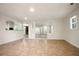 Open basement area with tile flooring and openings to other rooms, including the kitchen and a living space at 2729 Lanier Dr, Snellville, GA 30078