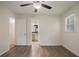 Comfortable bedroom featuring hardwood flooring and a view into the ensuite bathroom for added convenience at 2729 Lanier Dr, Snellville, GA 30078
