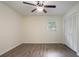 Bright bedroom with hardwood floors, ceiling fan, and window at 2729 Lanier Dr, Snellville, GA 30078