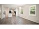 Dining area featuring new flooring, adjacent to kitchen with plenty of light at 2729 Lanier Dr, Snellville, GA 30078