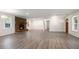 Inviting living room featuring a brick fireplace and luxury vinyl flooring at 2729 Lanier Dr, Snellville, GA 30078