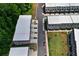 Aerial view of multi-Gathering residence showing ample parking, community green space, and modern architecture at 3493 Monarch Ave, Duluth, GA 30096