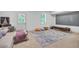 A finished basement features an open layout and a large projector screen at 3493 Monarch Ave, Duluth, GA 30096