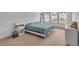 Bright bedroom with large bed, dresser, and view of neighborhood at 3493 Monarch Ave, Duluth, GA 30096