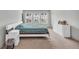Light filled bedroom with large bed, dresser, and carpeted floor at 3493 Monarch Ave, Duluth, GA 30096