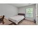 This bedroom offers a comfortable space with natural light from the window at 3493 Monarch Ave, Duluth, GA 30096