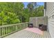 Relax on this private deck with outdoor seating and views of the surrounding trees at 3493 Monarch Ave, Duluth, GA 30096