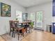 Bright dining area with hardwood floors, natural light, and stylish furniture, ideal for Gathering meals at 3493 Monarch Ave, Duluth, GA 30096
