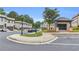 Street view showcasing brick townhomes with well-maintained landscaping and a community parking area at 3493 Monarch Ave, Duluth, GA 30096