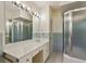Bathroom featuring a modern vanity, large mirror, and a separate glass-enclosed shower at 3672 Haddon Hall Rd, Atlanta, GA 30327