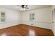 Inviting bedroom showcasing hardwood floors, bright windows and neutral walls at 3672 Haddon Hall Rd, Atlanta, GA 30327