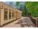 Enjoy outdoor living on this home's spacious wooden deck with views of the surrounding trees and natural landscape at 3672 Haddon Hall Rd, Atlanta, GA 30327