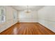 Formal dining room featuring hardwood floors, elegant wainscoting, and a chandelier at 3672 Haddon Hall Rd, Atlanta, GA 30327
