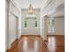 Bright and airy foyer featuring hardwood floors, decorative trim and natural light at 3672 Haddon Hall Rd, Atlanta, GA 30327