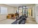 Home gym featuring workout equipment, mirrors, and a comfortable carpeted floor at 3672 Haddon Hall Rd, Atlanta, GA 30327