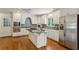 Well-equipped kitchen with stainless steel appliances, granite countertops, and hardwood floors at 3672 Haddon Hall Rd, Atlanta, GA 30327