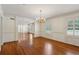 Spacious living room featuring hardwood floors and a decorative chandelier at 3672 Haddon Hall Rd, Atlanta, GA 30327