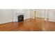 Hardwood floors, fireplace, and classic architectural features in this spacious living room at 3672 Haddon Hall Rd, Atlanta, GA 30327