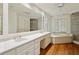 Spacious main bathroom features dual sinks, a soaking tub, and a shower, providing a luxurious experience at 3672 Haddon Hall Rd, Atlanta, GA 30327