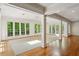 Bright sunroom featuring large windows and hardwood floors at 3672 Haddon Hall Rd, Atlanta, GA 30327