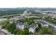 Aerial view of apartments surrounded by trees and highway with the city skyline in the distance at 970 Sidney Marcus Ne Blvd # 2403, Atlanta, GA 30324