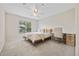 Bright bedroom with a bed, desk, and large window overlooking greenery at 970 Sidney Marcus Ne Blvd # 2403, Atlanta, GA 30324