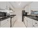 Galley kitchen with stainless steel appliances and white cabinetry at 970 Sidney Marcus Ne Blvd # 2403, Atlanta, GA 30324