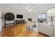 Living room with a fireplace, balcony access, hardwood floors, and modern decor at 970 Sidney Marcus Ne Blvd # 2403, Atlanta, GA 30324