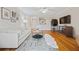 Cozy living room featuring hardwood floors, modern furniture, and a view into the kitchen at 970 Sidney Marcus Ne Blvd # 2403, Atlanta, GA 30324