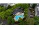 Aerial view of a clover-shaped pool surrounded by lush landscaping and community buildings at 970 Sidney Marcus Ne Blvd # 2403, Atlanta, GA 30324