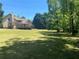 Extensive backyard with mature trees creating a serene and private oasis at 1173 Jimson Se Cir, Conyers, GA 30013