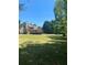 A spacious, green backyard showcasing the home's deck and outdoor potential at 1173 Jimson Se Cir, Conyers, GA 30013