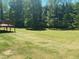 Tranquil backyard with mature trees, offering a peaceful and private setting at 1173 Jimson Se Cir, Conyers, GA 30013