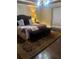 Comfortable bedroom with plush bedding, designer rug, and ambient lighting at 1173 Jimson Se Cir, Conyers, GA 30013