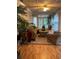 Bright sunroom featuring natural light, tropical plants, and comfortable seating area at 1173 Jimson Se Cir, Conyers, GA 30013