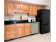 Kitchen showcasing stainless steel appliances, modern countertops, and custom wood cabinetry at 1409 Oakridge Cir, Decatur, GA 30033