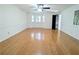 Large living room featuring beautiful hardwood floors and a bay window with shutters at 1409 Oakridge Cir, Decatur, GA 30033