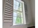 Window with white frame and white shutters at 1409 Oakridge Cir, Decatur, GA 30033