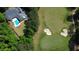 Stunning aerial view of a home with a pool located right on the edge of a beautiful golf course at 850 Cog Hl, Mcdonough, GA 30253