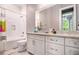 Bright bathroom features a shower-tub combo, tile backsplash, and white vanity with great counter space at 850 Cog Hl, Mcdonough, GA 30253