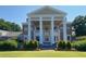 Stately clubhouse with grand columns and beautifully landscaped grounds, creating an inviting and impressive entrance at 850 Cog Hl, Mcdonough, GA 30253