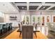 Beautiful dining room with a dark wood table and seating for eight, with hardwood floors and access to the outside patio at 850 Cog Hl, Mcdonough, GA 30253