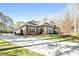 Long driveway leading to a beautiful home with well-manicured landscaping and ample parking space at 850 Cog Hl, Mcdonough, GA 30253