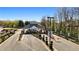 Elegant gated community entrance with lush landscaping and well-maintained roadways, offering security and curb appeal at 850 Cog Hl, Mcdonough, GA 30253